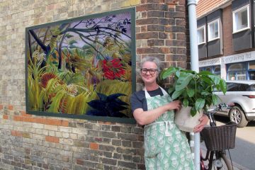 Rachel with Rousseau's 'Surprised' outside her flower shop © Siri Taylor